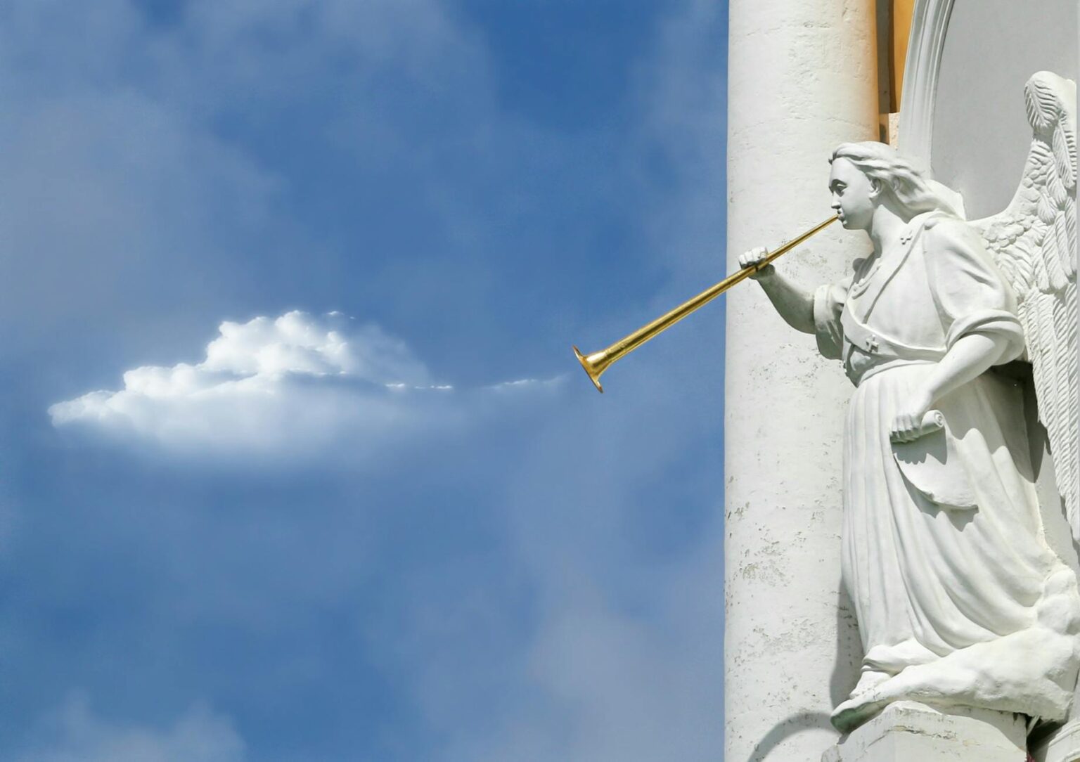 horning angel statuette