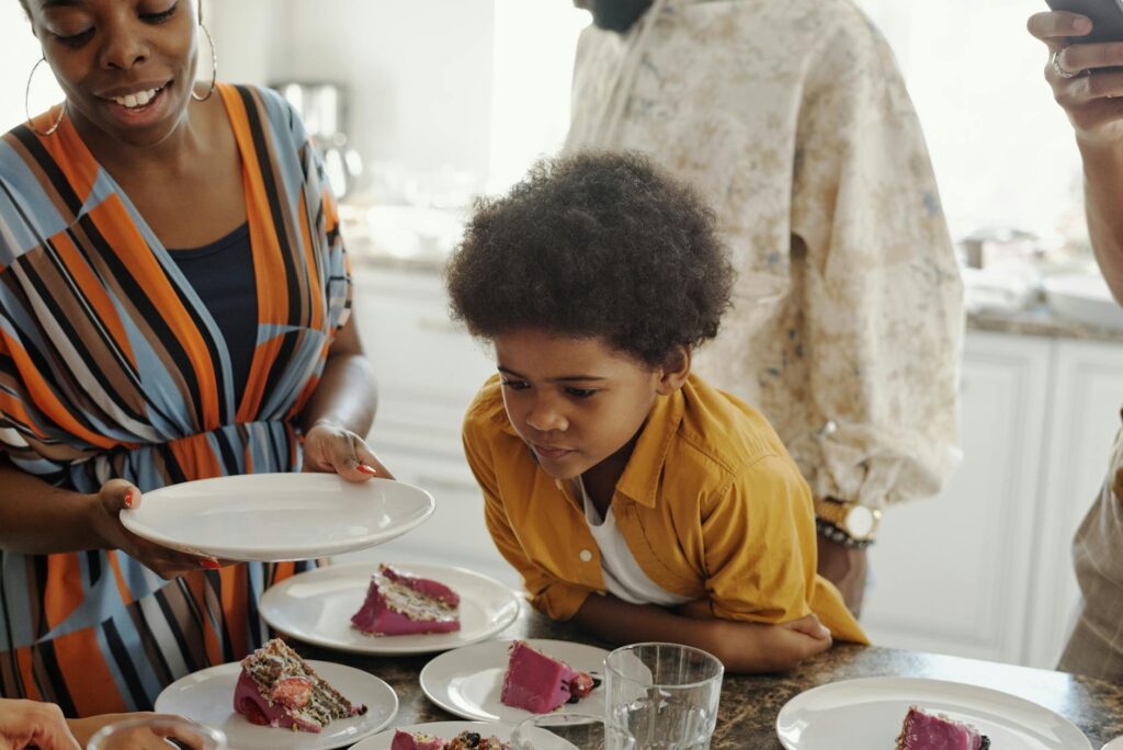 boy waiting for a piece of cake