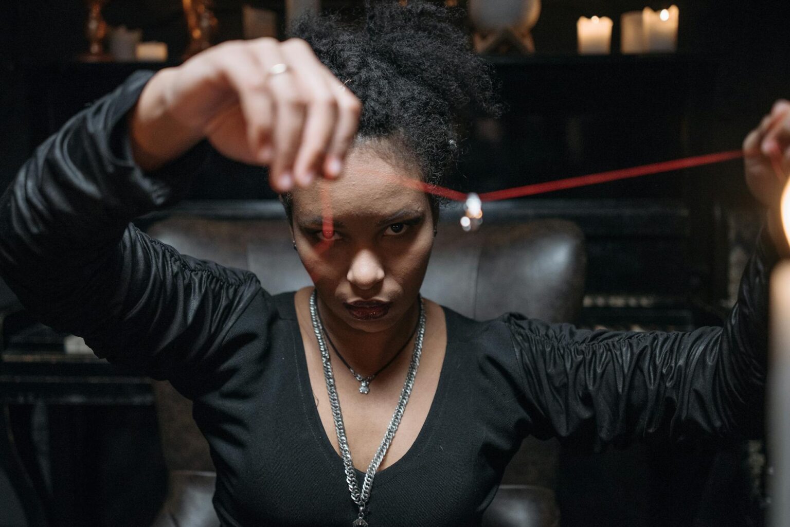 a woman holding a necklace