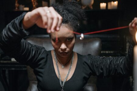 a woman holding a necklace