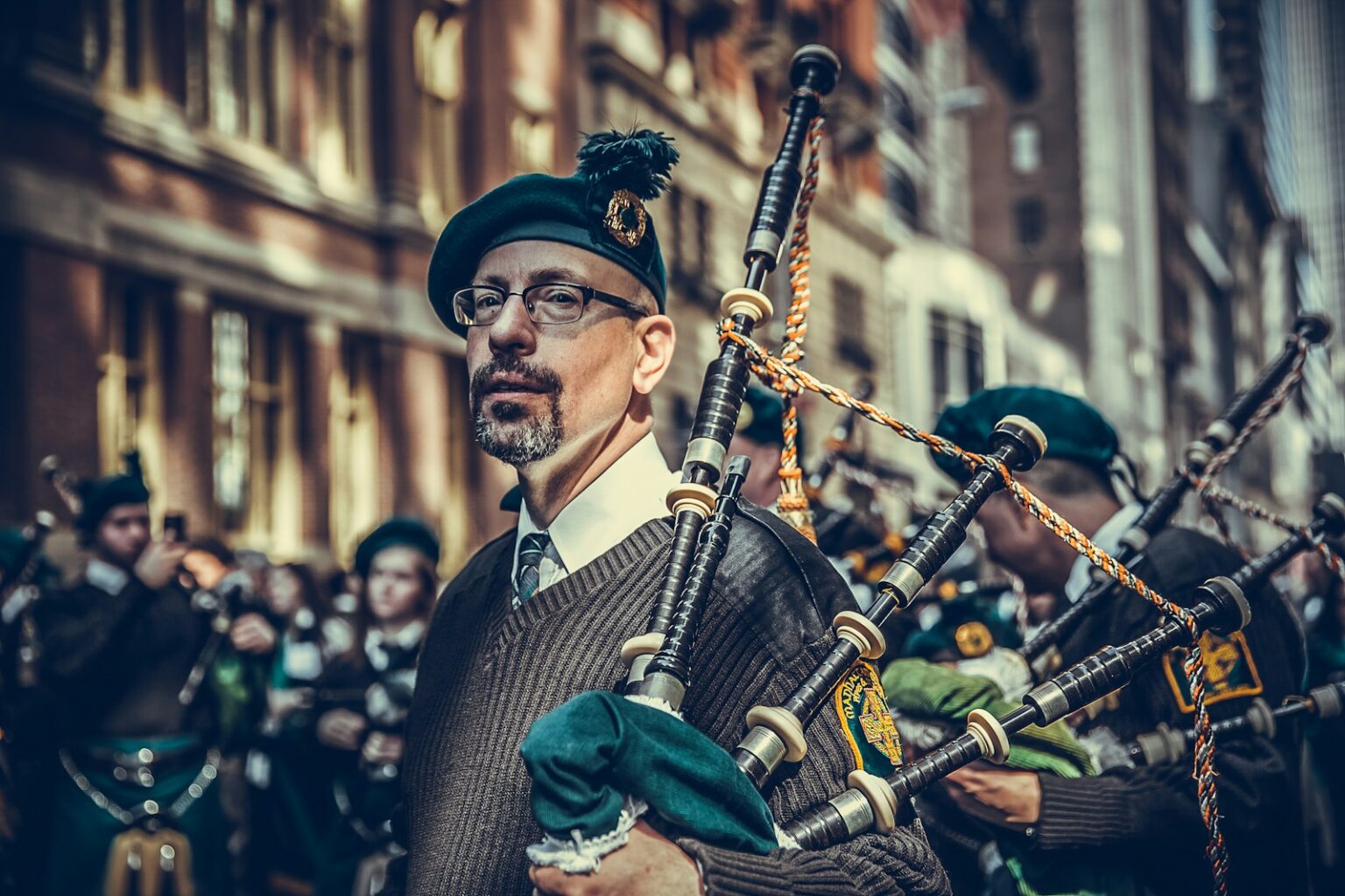 close-up photography of man carrying instrument