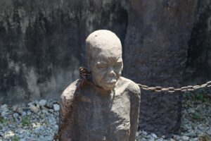 A statue of a person chained to a chain
