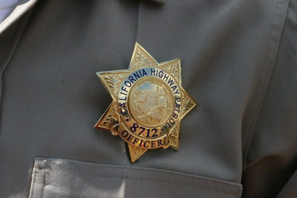 # ⚖️ THE RIVER KNOWS: Lucius Amerson, the Klan, and the Silence That Swallowed an Investigation### *A Long-Form Investigative Essay in 12 Paragraphs* A close up of a police officer's uniform